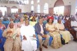 Cross session of dignitaries and worshippers